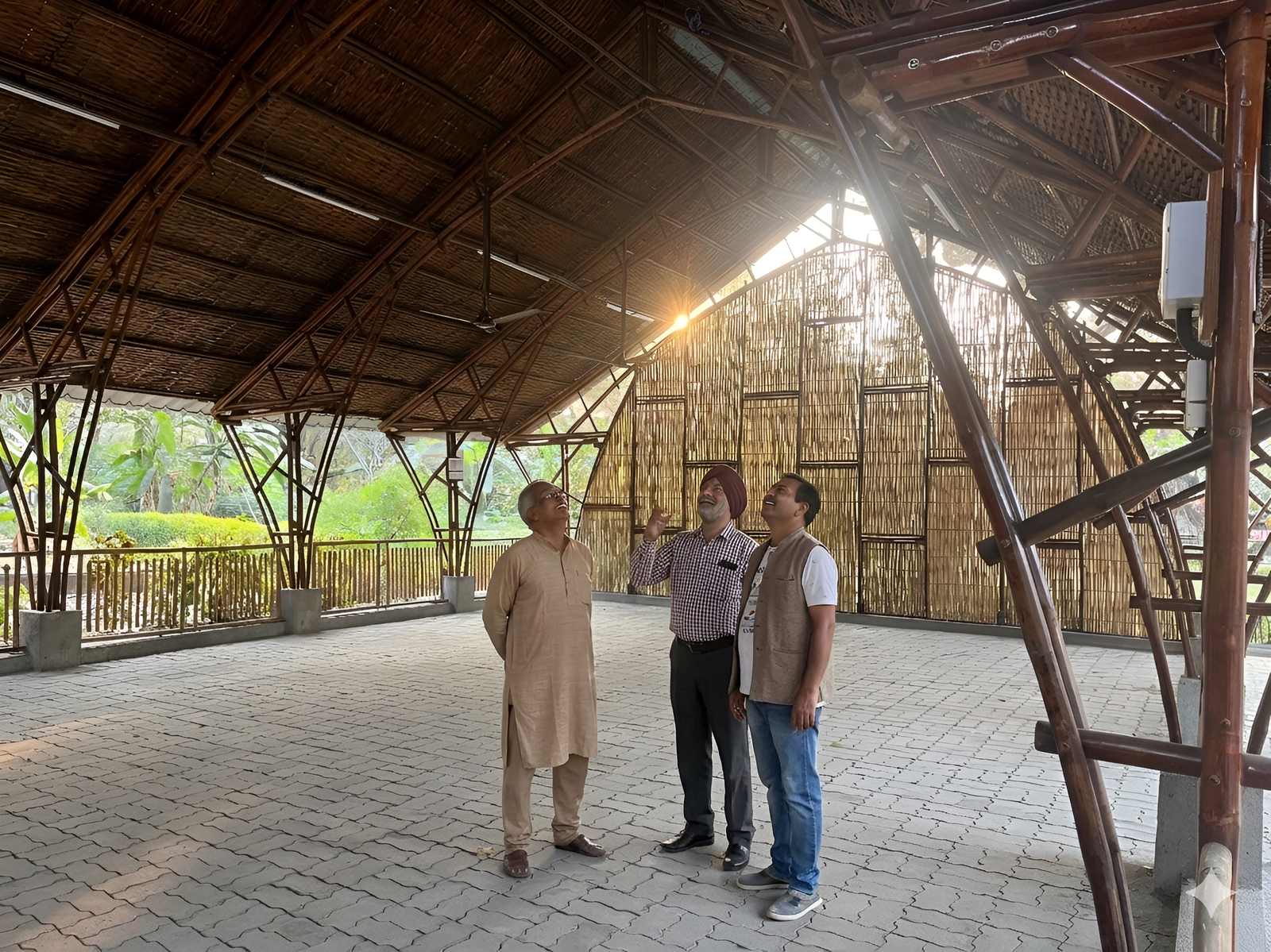 Interior — open gathering hall with bamboo truss roof and natural light