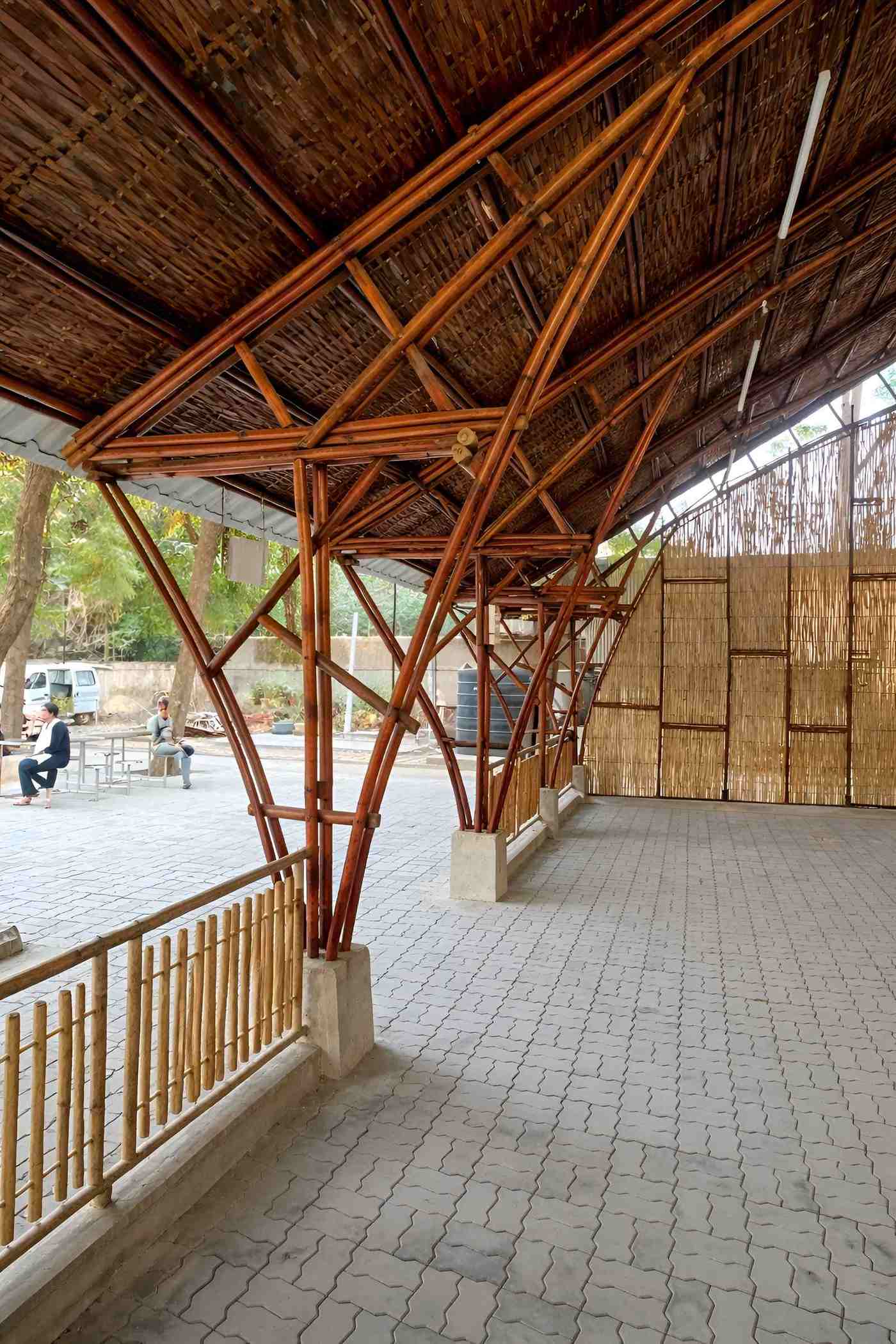 Interior — open hall looking out through bamboo columns to the garden