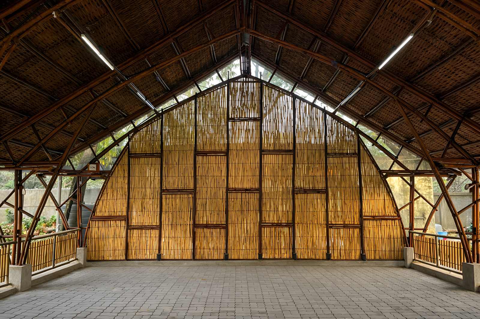 Interior — bamboo arch truss and ceiling structure in warm light